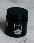 A black jar of Só Silver Mission Falls Premium Ionic Silver Gel, 100 ml, set on a textured light gray surface.