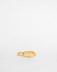 A small light wood scoop on a white backdrop.