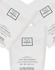 Three white pouches of Só Clean Citrus Dish Capsules arranged in a fan shape on a white background, with the brand logo and product details clearly visible.