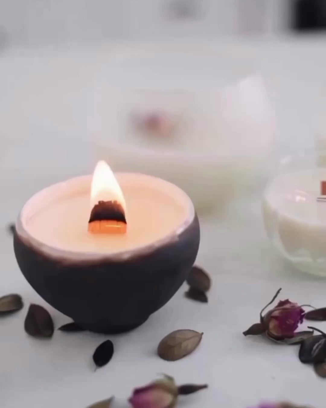 Video depicting a lit candle, a running bath and a foot in the bath with text overlay that says "never feel guilty about taking time for yourself."